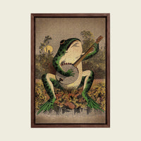 A Frog Playing Banjo in the Moonlight canvas wall art in a floating walnut frame