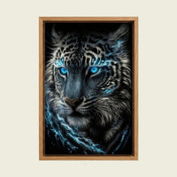 Blue-Eyed Black Leopard canvas wall art in a floating oak frame