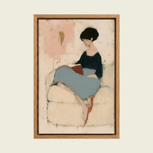Woman Reading a Book canvas wall art in a floating oak frame