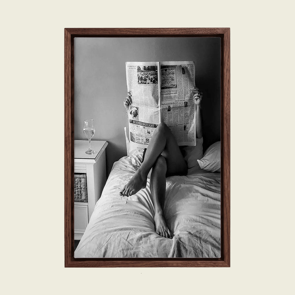Woman Reading the Newspaper in Bed canvas wall art in a floating walnut frame