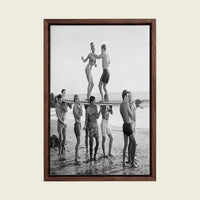 Surfers Beach Party canvas wall art in a floating walnut frame