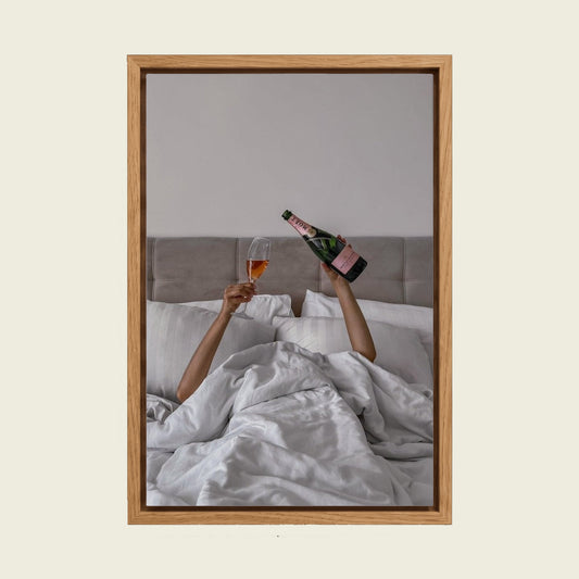 Woman Drinking Wine in Bed canvas wall art in a floating oak frame